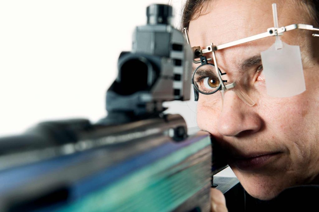 Close up portrait of a female sport shooter wearing her special kit