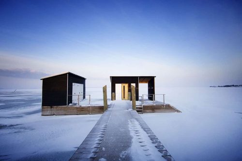 Scandinavian sauna hut on the frozen sea