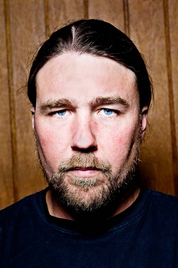 Head and shoulders portrait of a stern looking man