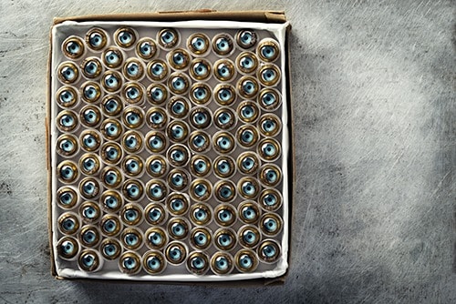 Collection of glass eyes for dolls in a box