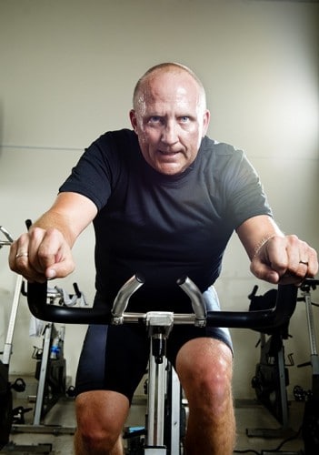 Fitness instructor on a spinning bike