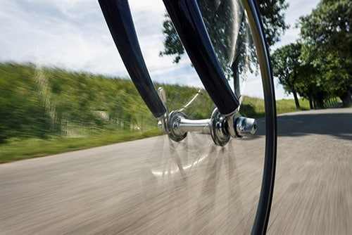 Low angle view of bike moving down the road.