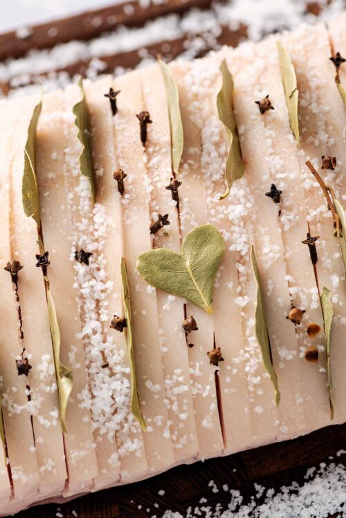 Flæskesteg joint of pork prepared and ready to be roasted in the oven.