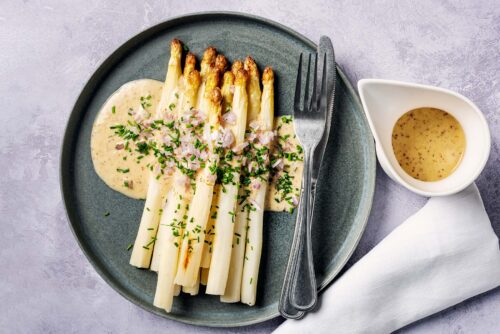 White asparagus with a vinaigrette dressing.